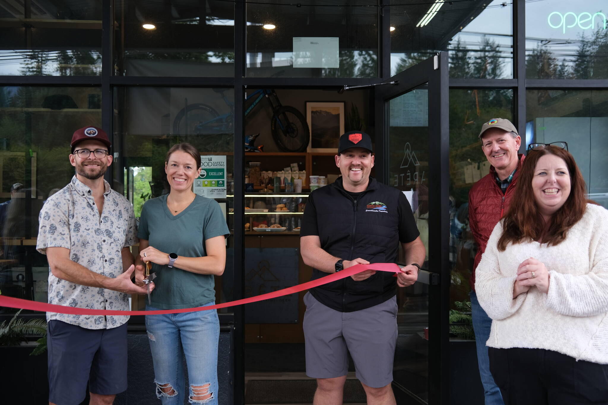 Meghan and David Schumacher prepare for the ribbon-cutting at their new North Bend location.